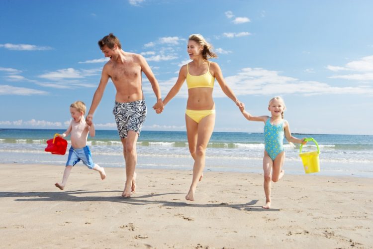 bigstock-Family-on-beach-vacation-30047474